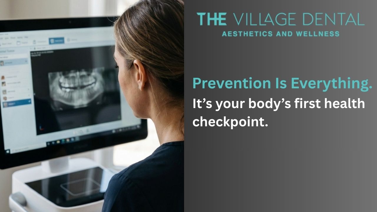 Dental professional reviewing an X-ray on a computer screen at The Village Dental, emphasizing preventive care for oral health in Miami, FL.