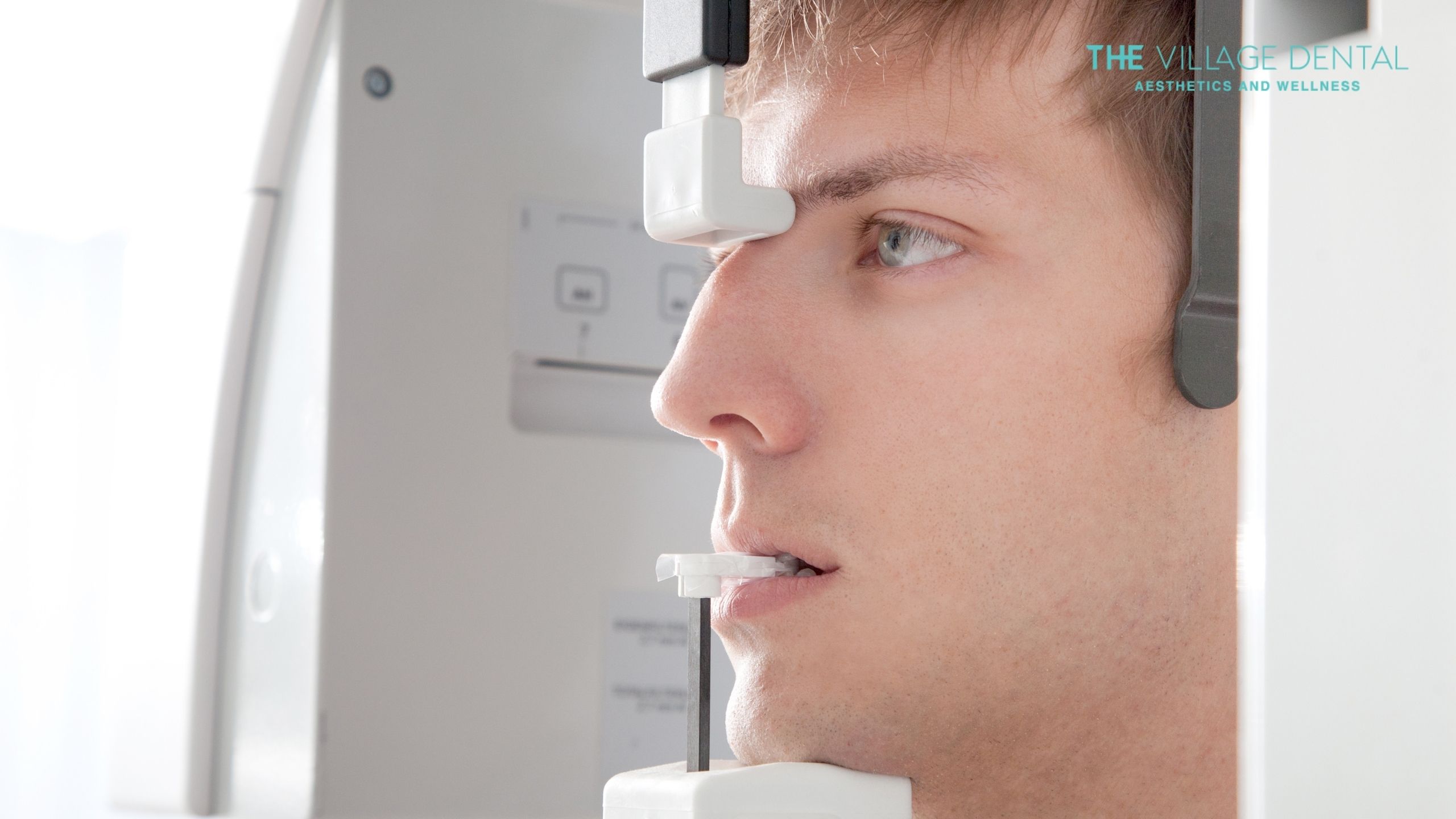 Patient undergoing a digital CT scan at The Village Dental in Pinecrest, Florida, for precise dental implant planning and evaluation of oral health.