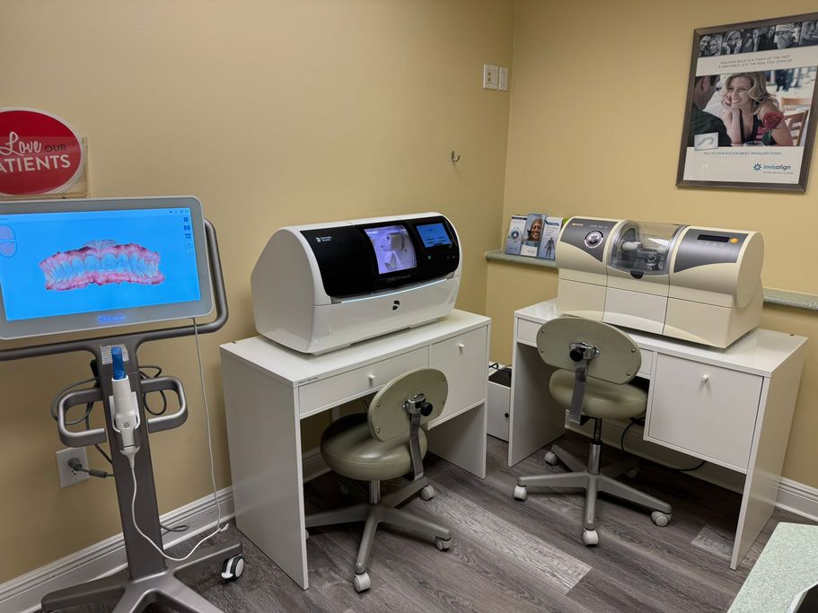 Advanced dental technology setup at The Village Dental, featuring iTero scanner for Invisalign, CEREC machine for same-day crowns, and a digital display for precise dental imaging, promoting modern and efficient patient care in Pinecrest, FL.