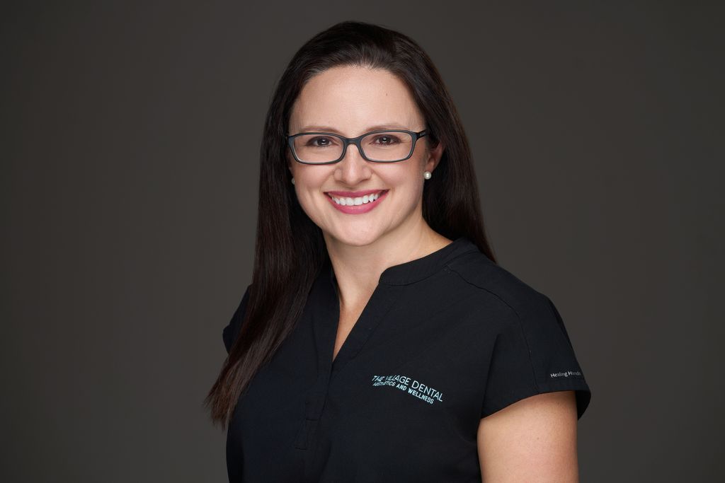 Rebecca Thomas, dental assistant at The Village Dental in Pinecrest, FL, smiling in professional attire, promoting patient-centered dental care and wellness.