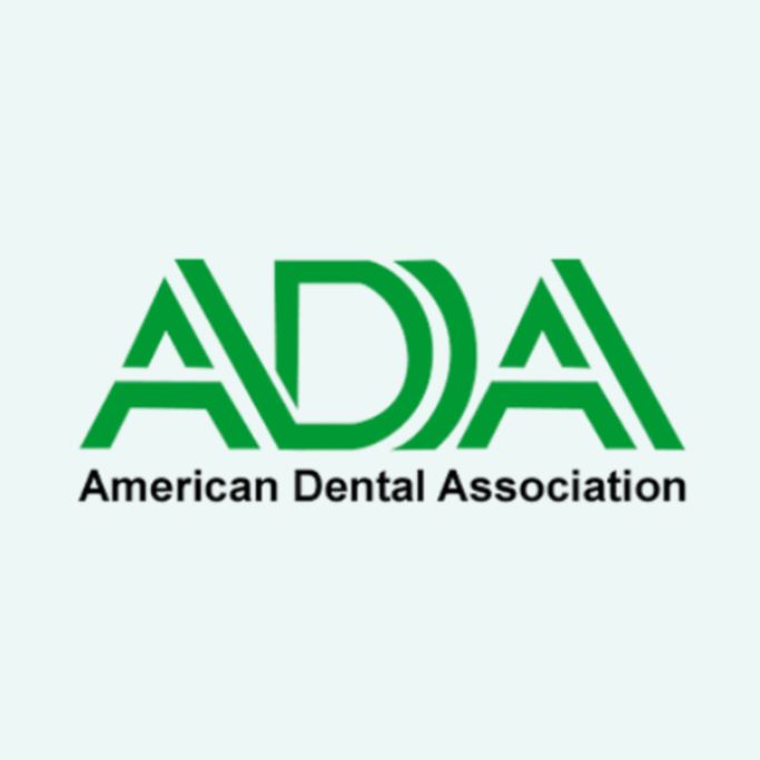 Logo of the American Dental Association (ADA) featuring green lettering and a professional design, representing The Village Dental's commitment to quality dental care in Pinecrest, FL.