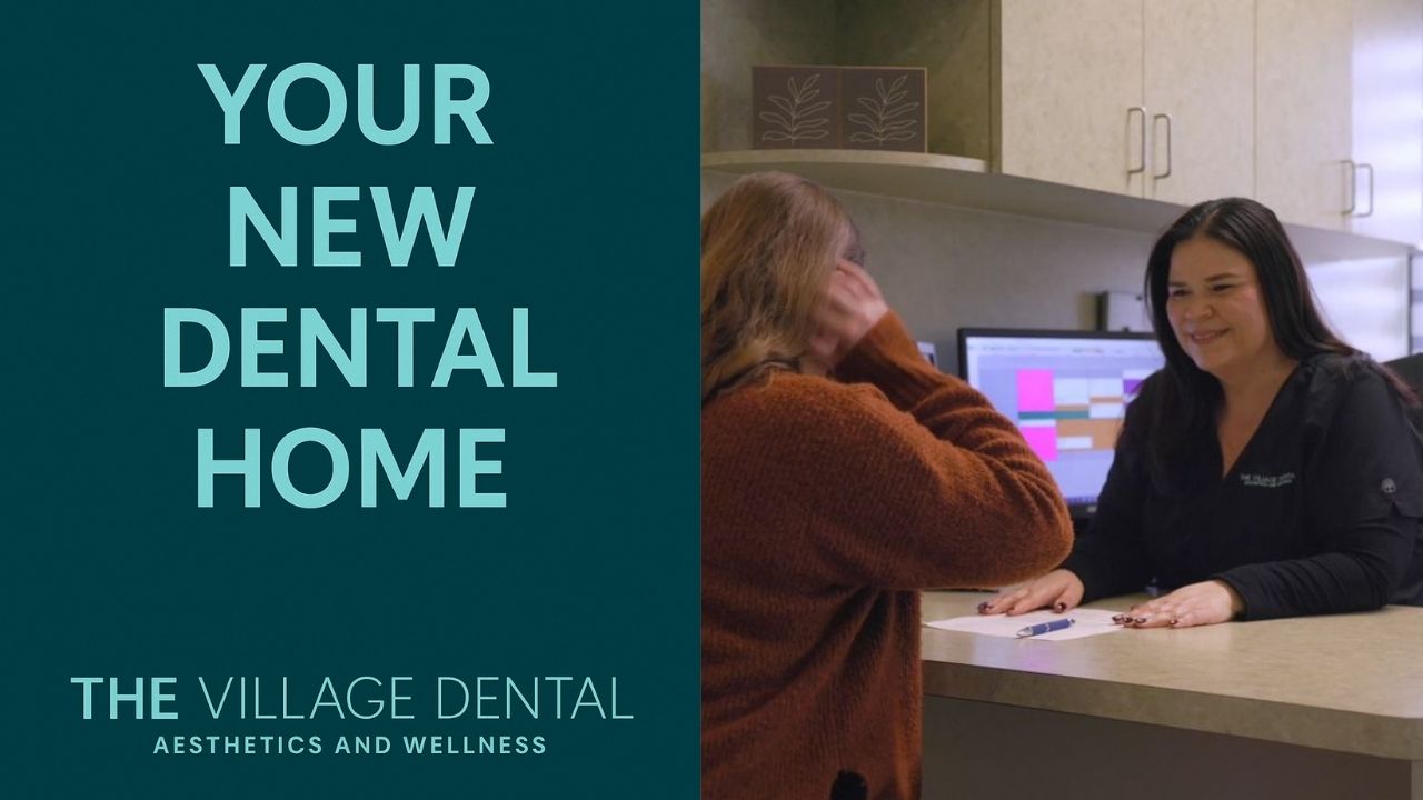 Reception area at The Village Dental, featuring a welcoming staff member assisting a patient, with text overlay "Your New Dental Home," emphasizing community-focused family dental care in Pinecrest, FL.